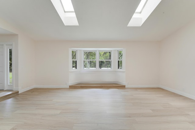13655 N 68th St N, West Palm Beach, FL 33412 - empty room with a skylight and light wood-style flooring