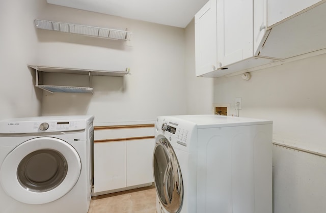13655 N 68th St N, West Palm Beach, FL 33412 - washroom featuring cabinet space, washing machine and dryer, and light tile patterned flooring