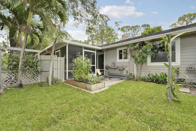 13655 N 68th St N, West Palm Beach, FL 33412 - back of house with a sunroom and a chimney