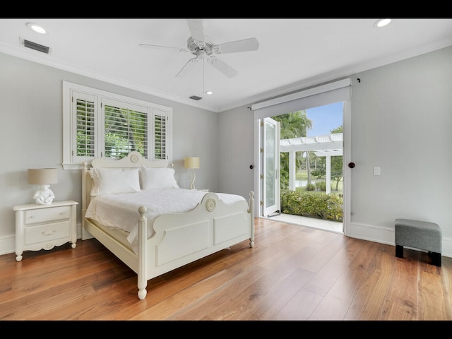 12990 Marsh Lndg, Palm Beach Gardens, FL 33418 - bedroom with access to exterior, multiple windows, ornamental molding, wood finished floors, and ceiling fan