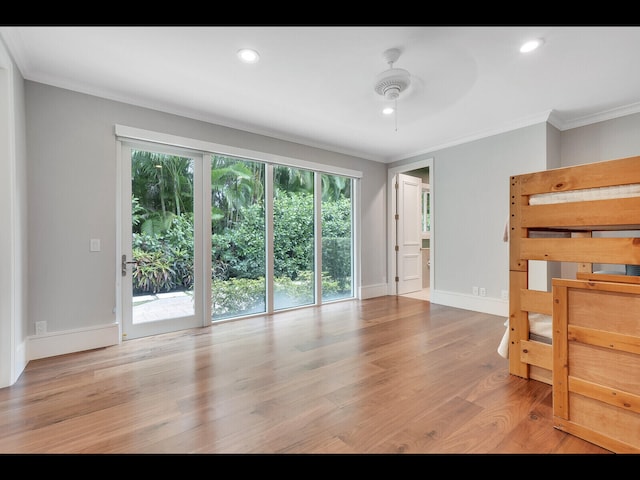 12990 Marsh Lndg, Palm Beach Gardens, FL 33418 - unfurnished bedroom featuring ornamental molding, wood finished floors, access to exterior, and recessed lighting