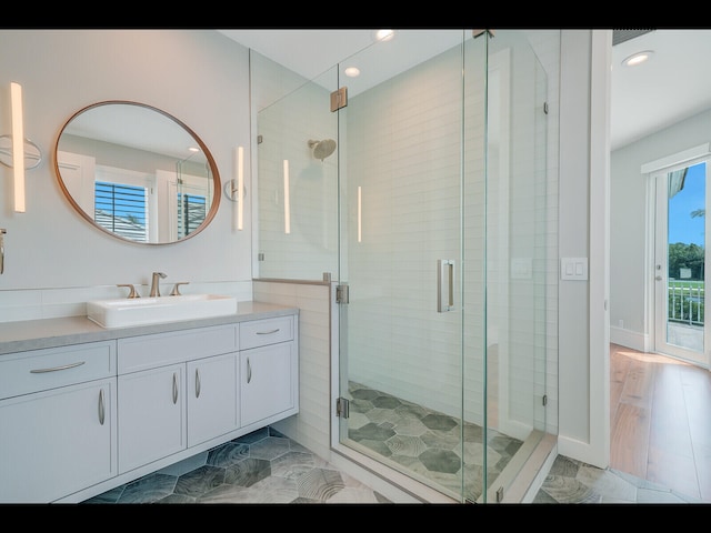 12990 Marsh Lndg, Palm Beach Gardens, FL 33418 - full bathroom featuring vanity, a shower stall, and recessed lighting