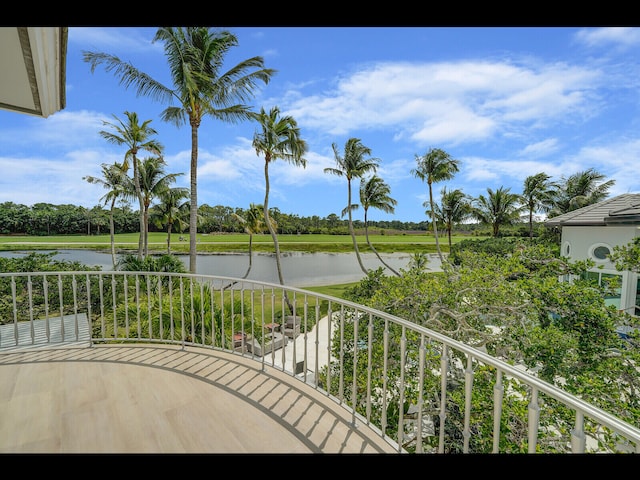 12990 Marsh Lndg, Palm Beach Gardens, FL 33418 - balcony with a water view and view of wooded area