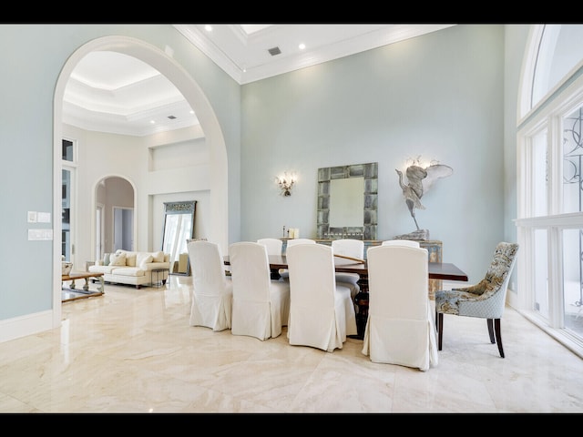 12990 Marsh Lndg, Palm Beach Gardens, FL 33418 - dining space featuring a high ceiling, crown molding, arched walkways, marble finish flooring, and recessed lighting