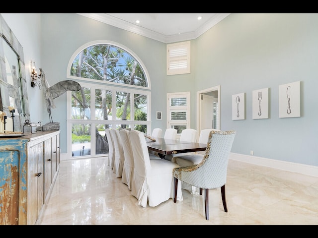 12990 Marsh Lndg, Palm Beach Gardens, FL 33418 - dining area featuring light marble finish floors, ornamental molding, a high ceiling, and recessed lighting