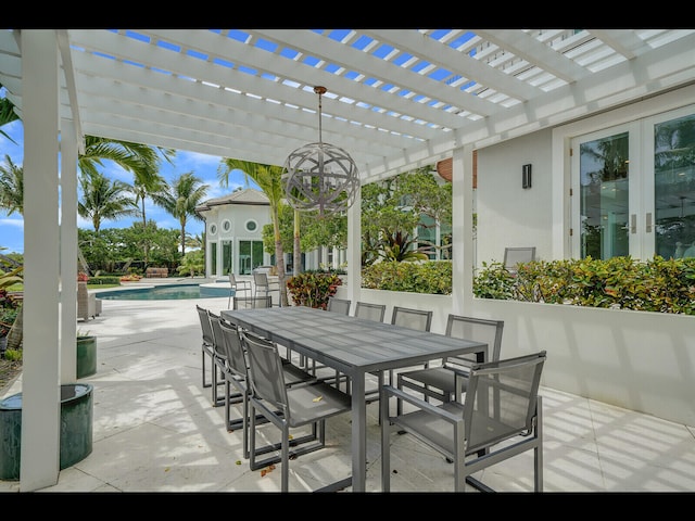 12990 Marsh Lndg, Palm Beach Gardens, FL 33418 - view of patio / terrace with a pergola, an outdoor pool, and outdoor dining area