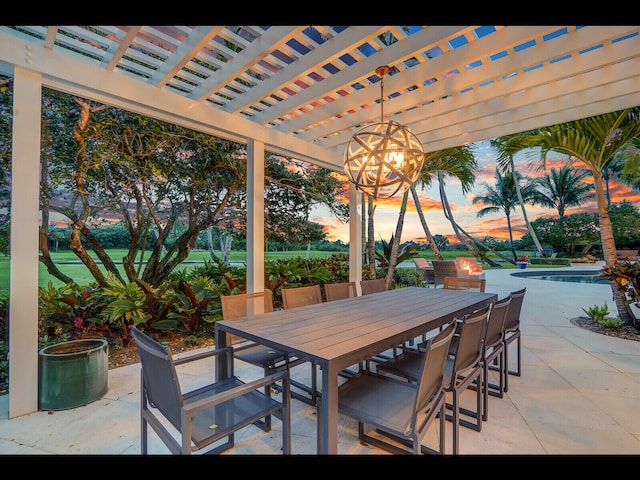 12990 Marsh Lndg, Palm Beach Gardens, FL 33418 - patio terrace at dusk featuring outdoor dining area, a pergola, and a patio area