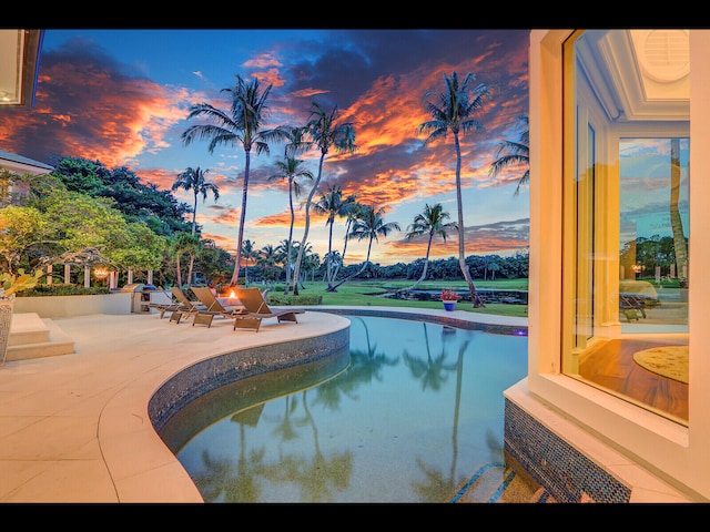 12990 Marsh Lndg, Palm Beach Gardens, FL 33418 - pool at dusk featuring a patio area, an outdoor fire pit, and an outdoor pool