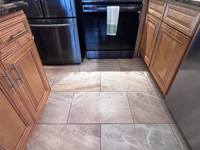 620 Horizons W Unit 105, Boynton Beach, FL 33435 - kitchen with fridge and brown cabinetry