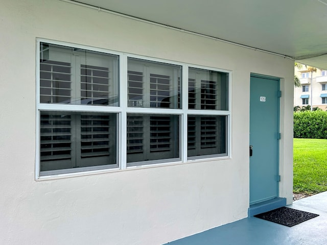 620 Horizons W Unit 105, Boynton Beach, FL 33435 - doorway to property featuring stucco siding