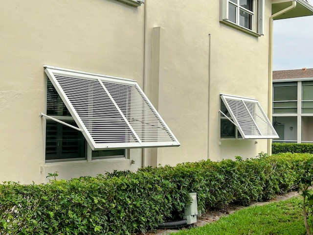 620 Horizons W Unit 105, Boynton Beach, FL 33435 - view of side of home featuring stucco siding