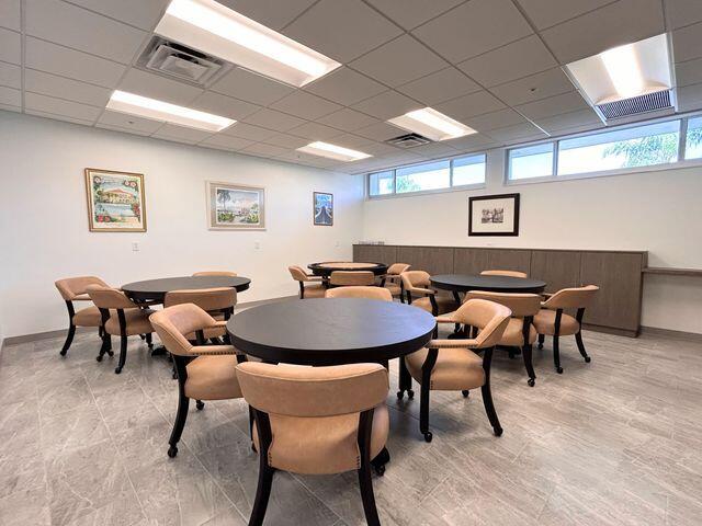 620 Horizons W Unit 105, Boynton Beach, FL 33435 - dining room featuring plenty of natural light, a drop ceiling, and baseboards