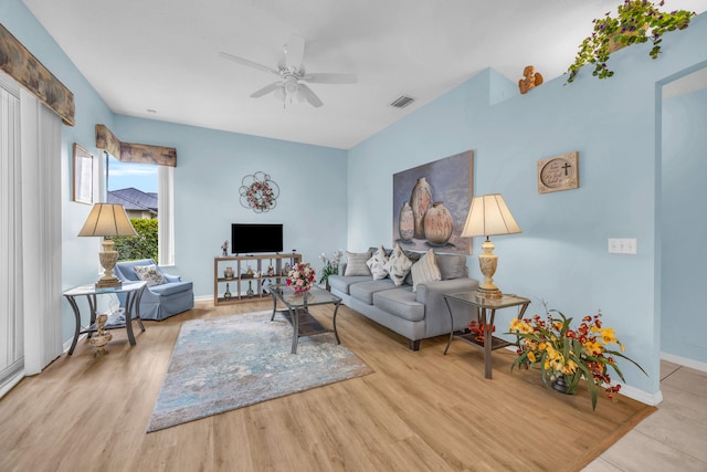 3592 SW Rosser Blvd, Port Saint Lucie, FL 34953 - living room featuring a ceiling fan, wood finished floors, and baseboards