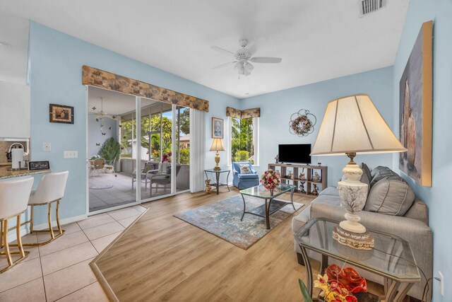 3592 SW Rosser Blvd, Port Saint Lucie, FL 34953 - tiled living room featuring ceiling fan and baseboards