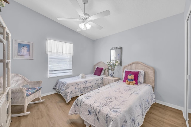 3592 SW Rosser Blvd, Port Saint Lucie, FL 34953 - bedroom featuring vaulted ceiling, wood finished floors, baseboards, and ceiling fan