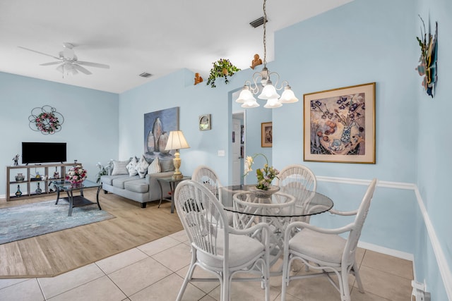 3592 SW Rosser Blvd, Port Saint Lucie, FL 34953 - dining area featuring tile patterned floors, a ceiling fan, a chandelier, and baseboards