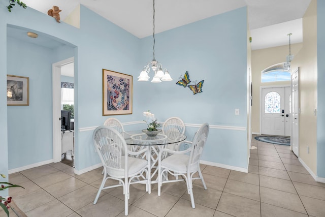 3592 SW Rosser Blvd, Port Saint Lucie, FL 34953 - dining space featuring plenty of natural light, tile patterned floors, baseboards, and a chandelier