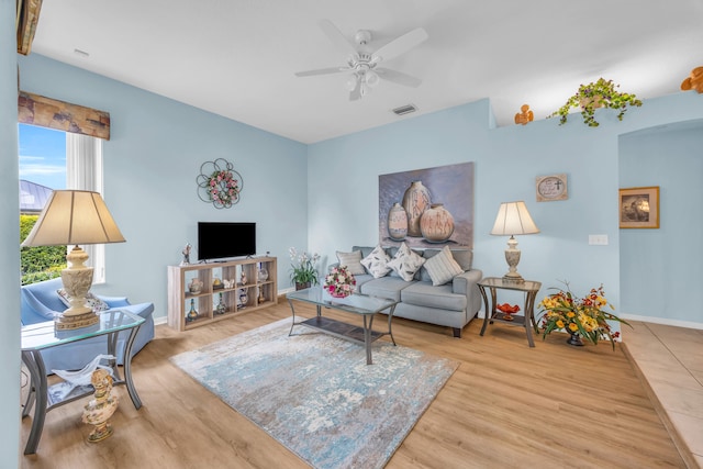 3592 SW Rosser Blvd, Port Saint Lucie, FL 34953 - living room with wood finished floors, ceiling fan, and baseboards