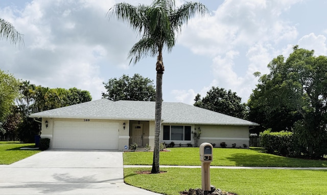 269 Ponce De Leon St, Royal Palm Beach, FL 33411 - single story home with concrete driveway, an attached garage, a front yard, and stucco siding
