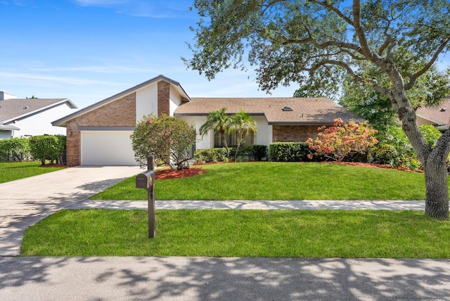 3099 NW 28th Ter, Boca Raton, FL 33434 - view of front of property featuring an attached garage, concrete driveway, a front yard, brick siding, and stucco siding