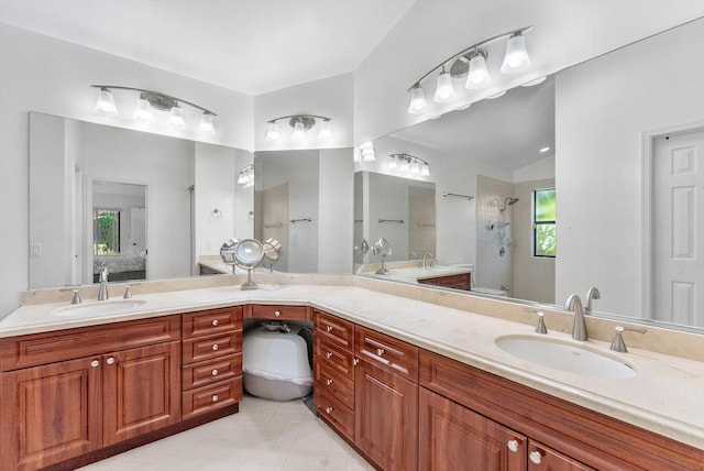 3099 NW 28th Ter, Boca Raton, FL 33434 - ensuite bathroom with tiled shower, double vanity, and tile patterned flooring