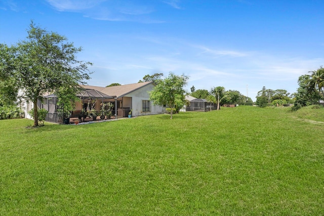 3099 NW 28th Ter, Boca Raton, FL 33434 - view of grassy yard featuring glass enclosure