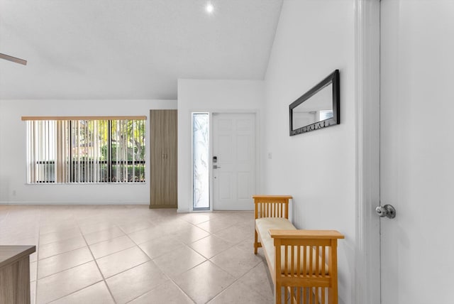 3099 NW 28th Ter, Boca Raton, FL 33434 - foyer entrance featuring vaulted ceiling, light tile patterned floors, and baseboards