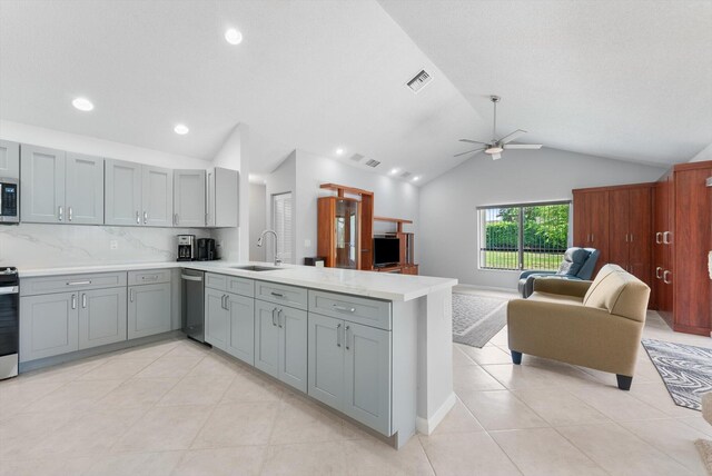 3099 NW 28th Ter, Boca Raton, FL 33434 - kitchen featuring stainless steel appliances, gray cabinets, a peninsula, open floor plan, and a ceiling fan