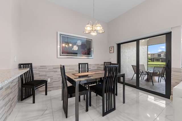 5255 Monterey Cir Unit G, Delray Beach, FL 33484 - dining room with a chandelier, light marble finish flooring, and a towering ceiling