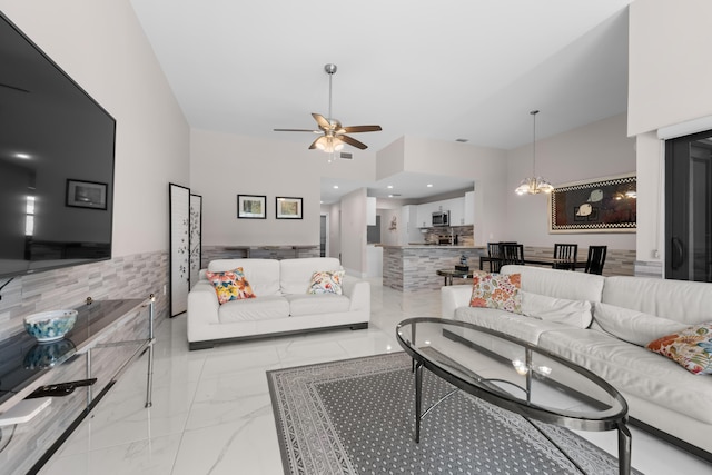 5255 Monterey Cir Unit G, Delray Beach, FL 33484 - living area featuring a ceiling fan, a chandelier, marble finish floors, and a high ceiling