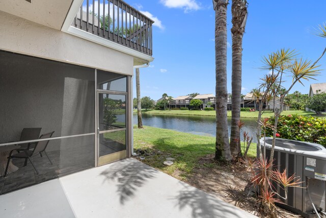 5255 Monterey Cir Unit G, Delray Beach, FL 33484 - view of patio featuring a balcony, central AC, a water view, and a sunroom