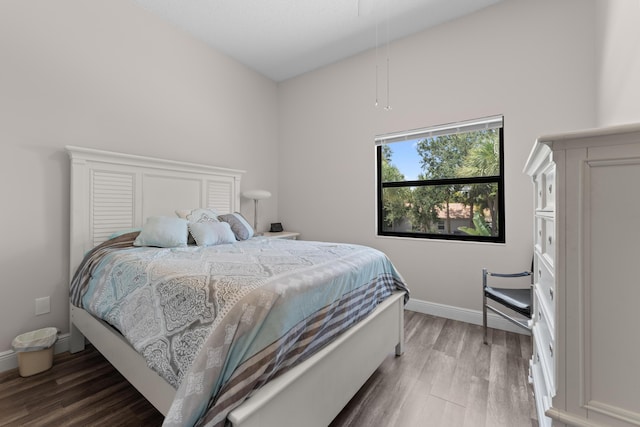 5255 Monterey Cir Unit G, Delray Beach, FL 33484 - bedroom featuring wood finished floors, baseboards, and attic access