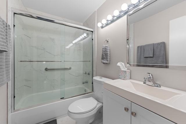 5255 Monterey Cir Unit G, Delray Beach, FL 33484 - bathroom featuring toilet, vanity, and shower / bath combination with glass door