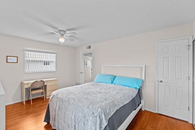 366 Saxony H, Delray Beach, FL 33446 - bedroom featuring wood finished floors, a ceiling fan, and baseboards