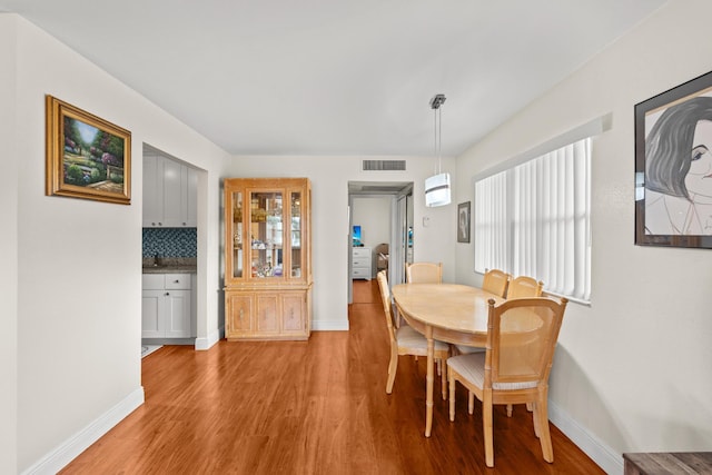 366 Saxony H, Delray Beach, FL 33446 - dining room featuring light wood-style floors and baseboards