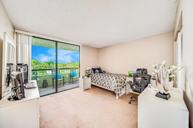6372 La Costa Dr Unit 306, Boca Raton, FL 33433 - bedroom with access to outside, carpet, a textured ceiling, and a wall of windows
