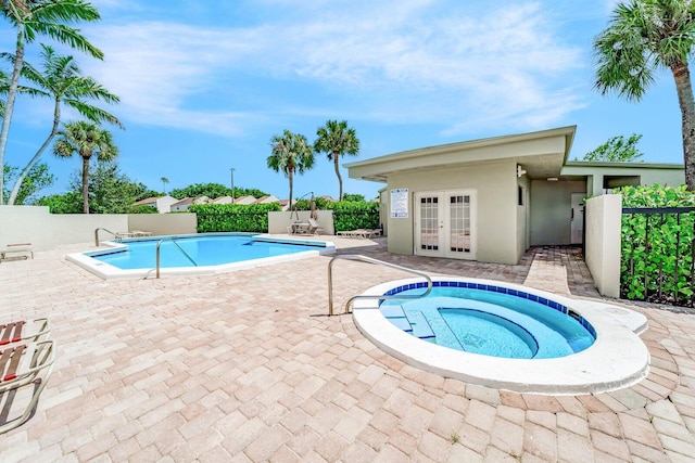 6372 La Costa Dr Unit 306, Boca Raton, FL 33433 - community pool with french doors, a patio area, and a community hot tub