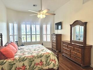 344 NW Stratford Ln, Port Saint Lucie, FL 34983 - bedroom with dark wood-type flooring and ceiling fan
