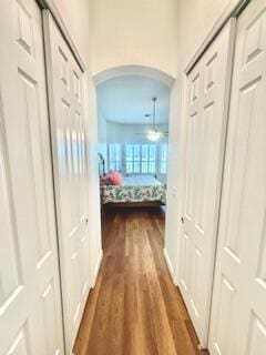 344 NW Stratford Ln, Port Saint Lucie, FL 34983 - hall featuring arched walkways and dark wood-style flooring