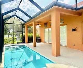 344 NW Stratford Ln, Port Saint Lucie, FL 34983 - outdoor pool with a patio area and a lanai