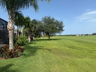 344 NW Stratford Ln, Port Saint Lucie, FL 34983 - view of grassy yard featuring view of golf course