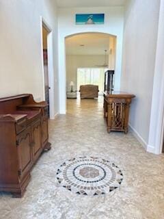 344 NW Stratford Ln, Port Saint Lucie, FL 34983 - corridor featuring arched walkways and baseboards