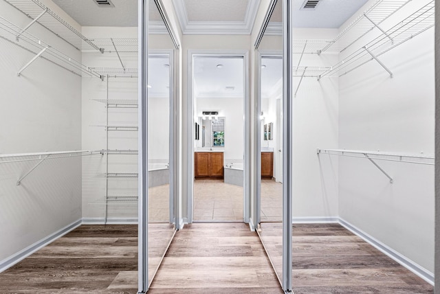 1415 SE Legacy Cove Cir, Stuart, FL 34997 - spacious closet featuring light wood finished floors