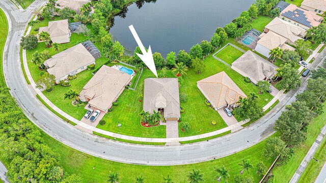 1415 SE Legacy Cove Cir, Stuart, FL 34997 - aerial view of residential area with a nearby body of water