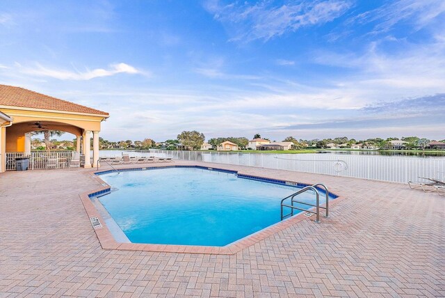 1415 SE Legacy Cove Cir, Stuart, FL 34997 - community pool featuring a patio area and a water view