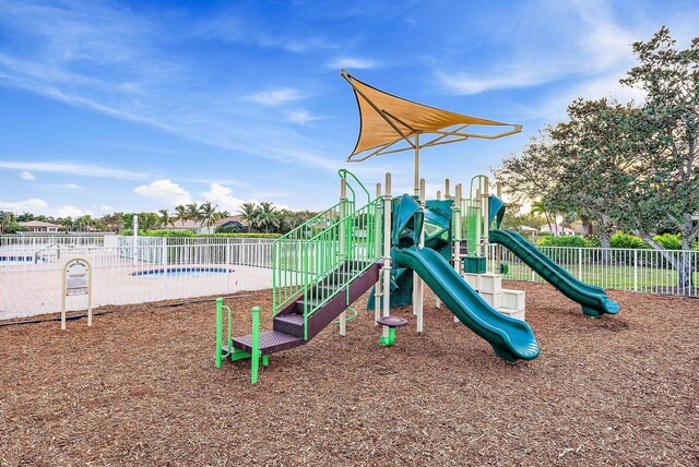 1415 SE Legacy Cove Cir, Stuart, FL 34997 - community playground with a swimming pool