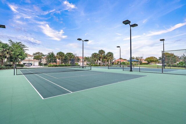 1415 SE Legacy Cove Cir, Stuart, FL 34997 - view of tennis court with community basketball court