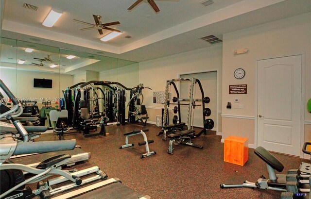 1415 SE Legacy Cove Cir, Stuart, FL 34997 - workout area with ceiling fan, a raised ceiling, and baseboards