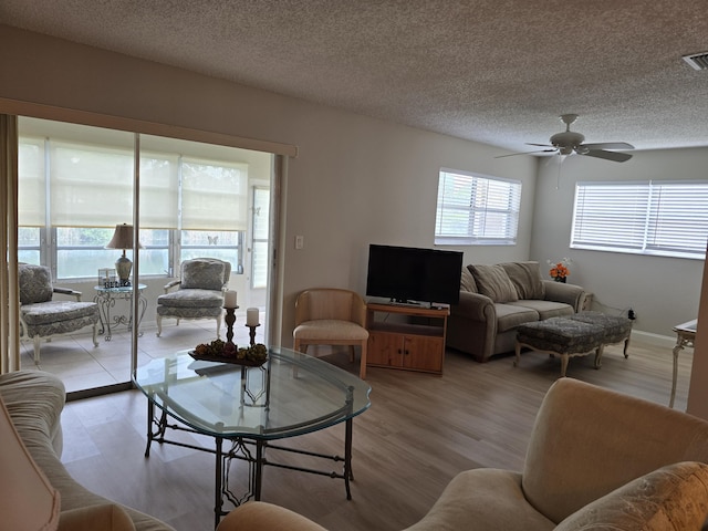 143 Lake Barbara Dr, West Palm Beach, FL 33411 - living area featuring light wood-style flooring, a ceiling fan, and a textured ceiling