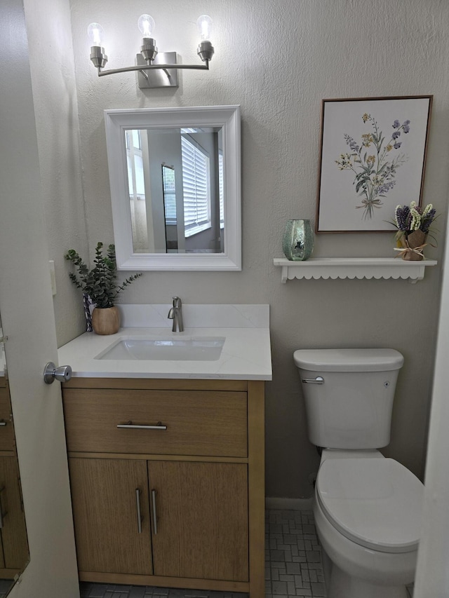 143 Lake Barbara Dr, West Palm Beach, FL 33411 - bathroom featuring vanity, toilet, and baseboards